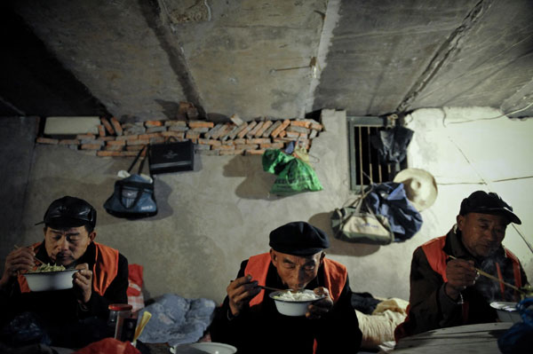 Migrant workers make their home under overpass