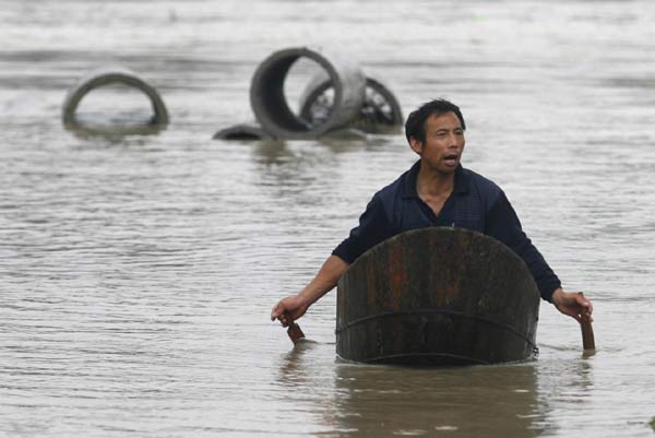 Floods kill 50; dozens remain missing
