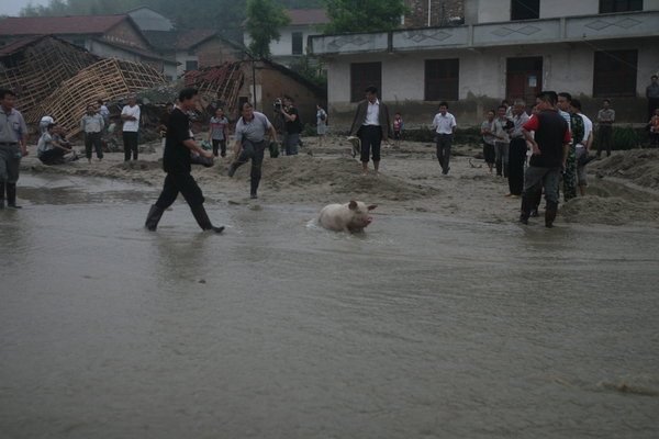 Flood and mudslide kill 29 in Central China
