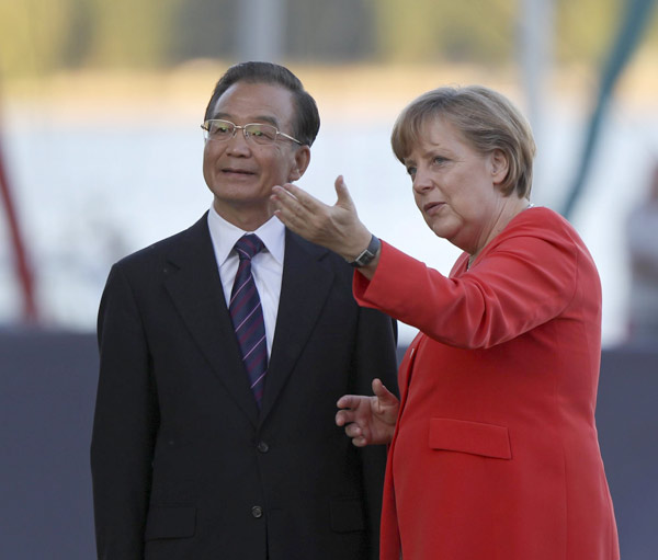 Premier Wen arrives in Germany, meets Merkel