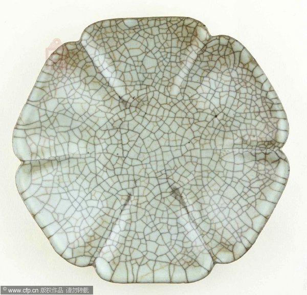 Photos of damaged ancient plate raise doubts