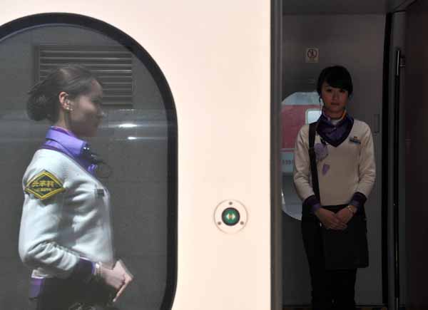 Bullet train stewardesses put on new uniforms