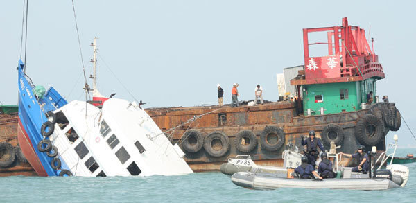Six crew detained after Hong Kong ship collision kills 38