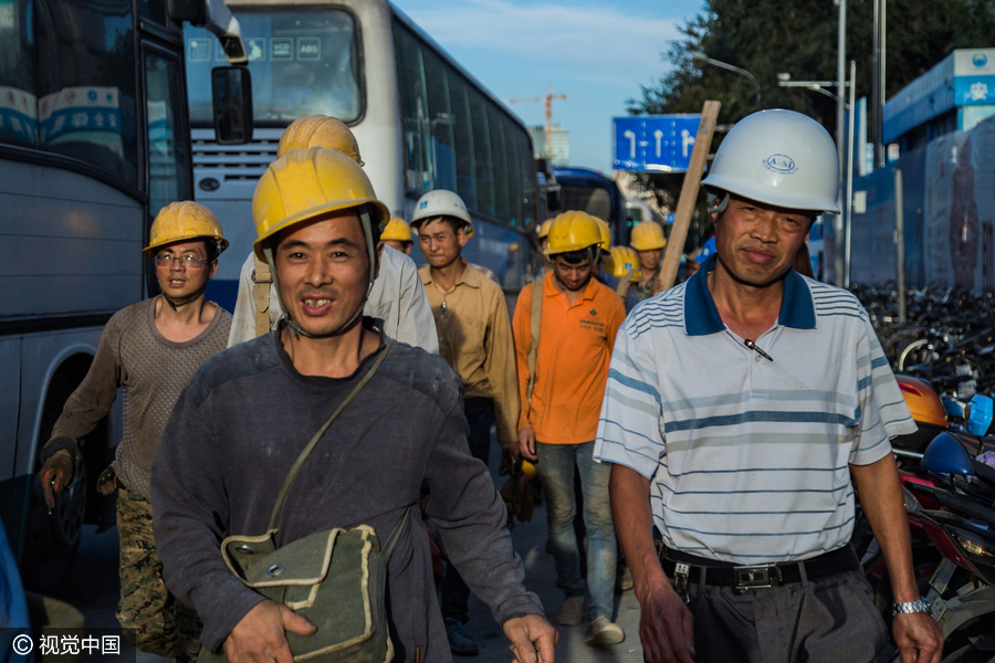Workers behind Beijing's tallest building