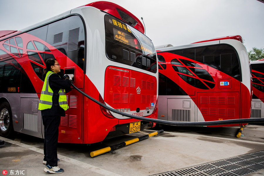 10 electric 'Chinese red' buses hit the roads in central Beijing