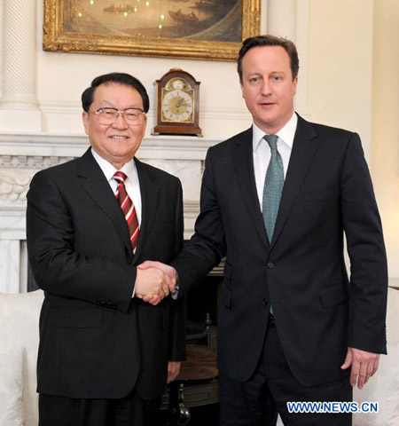 Senior CPC official meets British PM on ties