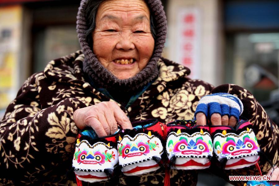 Handmade tiger-head shoes popular in China's new year