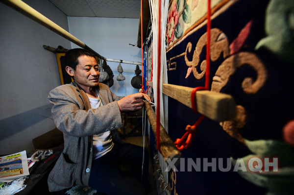 Bearer of Tibetan carpet in Qinghai