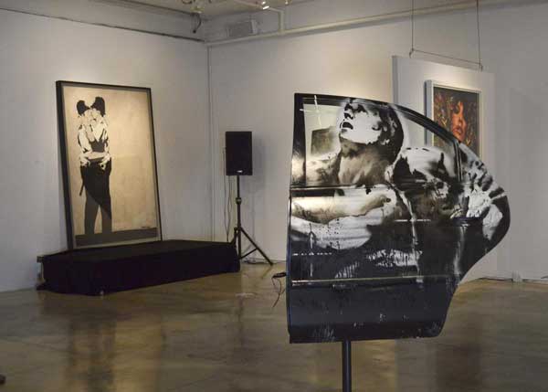 Banksy street art 'Kissing Coppers' up for auction in Miami