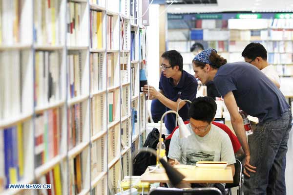 Residents read books at 24-hour bookstore in Beijing