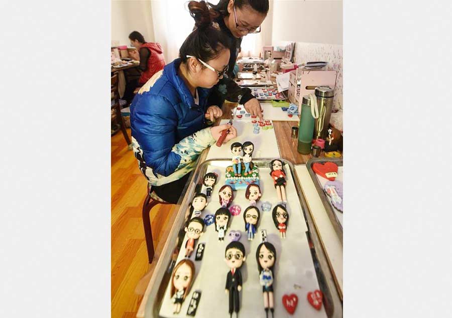 Tailor-made clay dolls presented at studio in Changchun