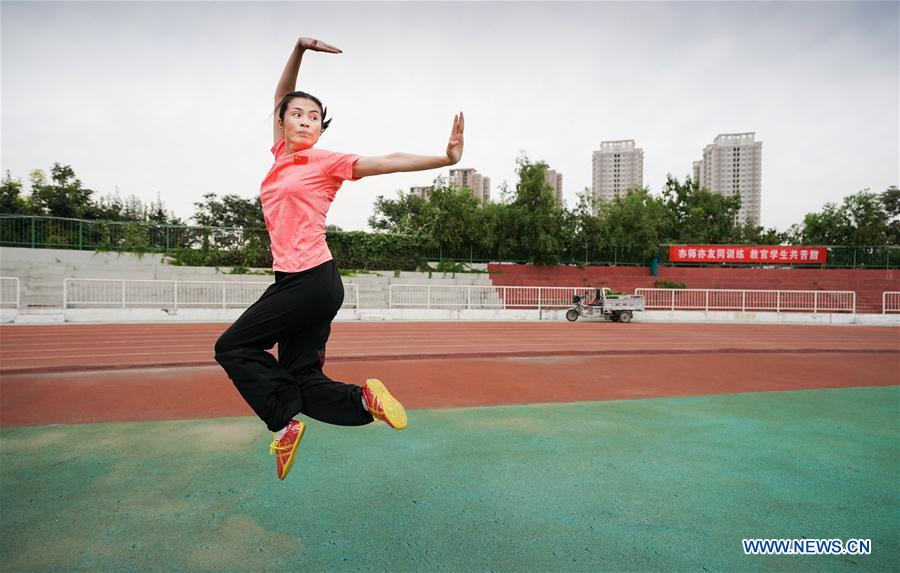 Wushu master practises boxing of Huo with her students in Tianjin