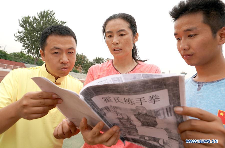 Wushu master practises boxing of Huo with her students in Tianjin