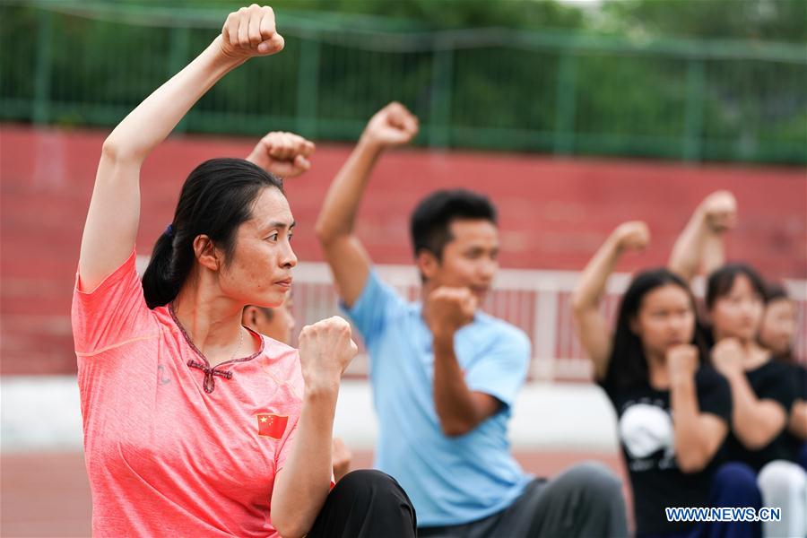 Wushu master practises boxing of Huo with her students in Tianjin