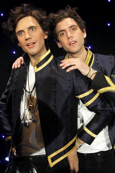 British singer Mika poses with his wax statue