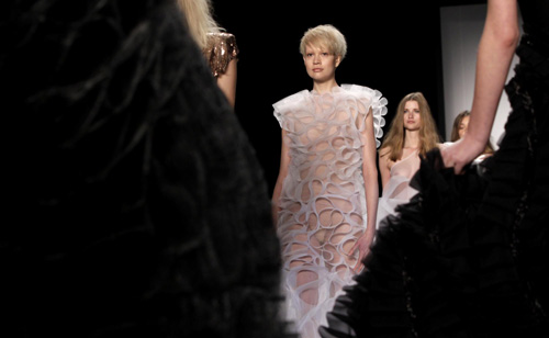 Models present a creation at Berlin Fashion Week
