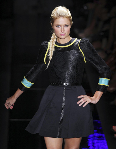 Paris Hilton presents a creation during Sao Paulo Fashion Week
