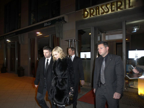 Madonna leaves a restaurant at Berlin's Gendarmenmarkt square