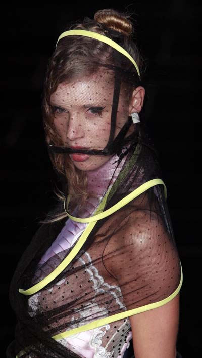 Models present creations during Sao Paulo Fashion week Summer 2012