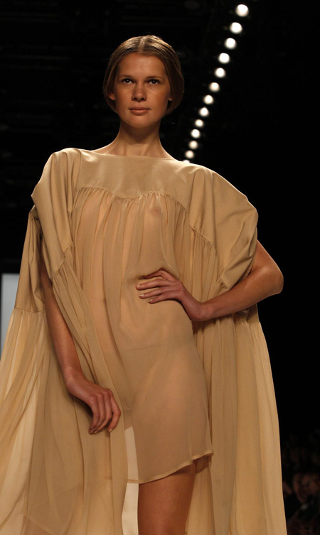 Models present creation at Berlin Fashion Week Spring/Summer 2012