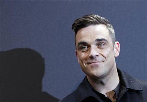 Robbie Williams takes UK pop charts' crown