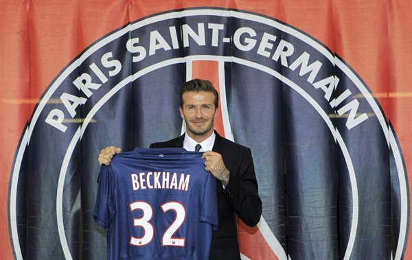 David Beckham arrives for a news conference in Paris