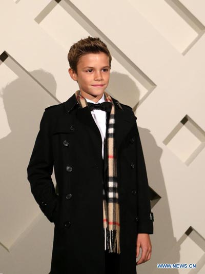 Like father like son: Romeo Beckham attends Burberry campaign