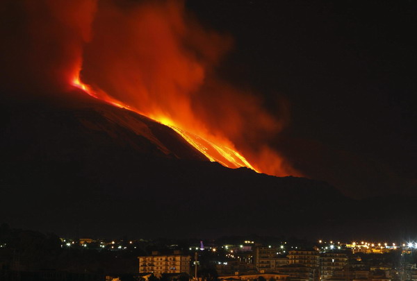 Mount Etna spews lava