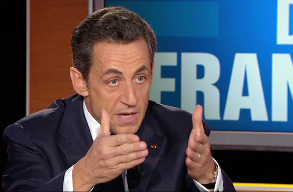 Sarkozy woos popular support for reforms at home
