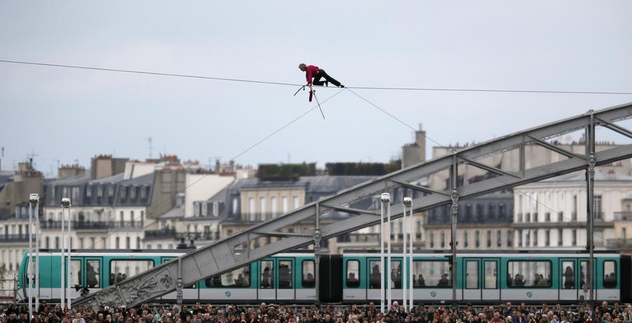 Tightrope walker completes walk over Seine river in Paris