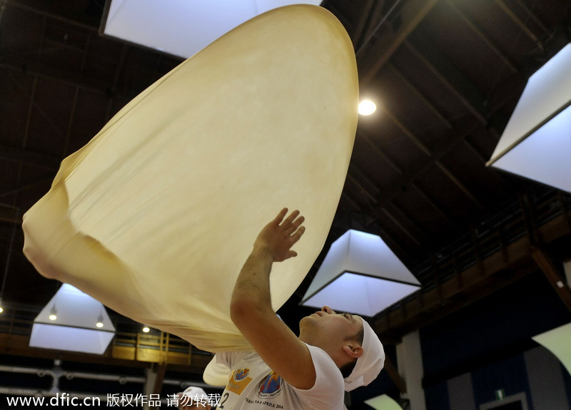 Bakers perform with dough in Pizza World Championships