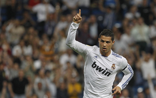 Ronaldo hat-trick keeps Barca waiting for title
