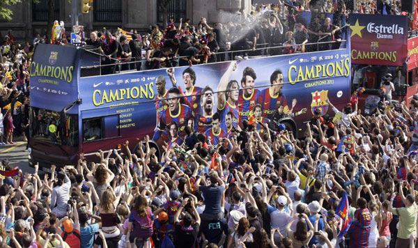 Barcelona savours sun-kissed trophy parade