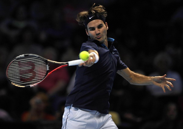 Federer warms up for semis with defeat of Fish