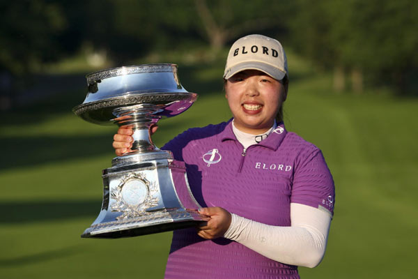 Feng wins first golf major for China