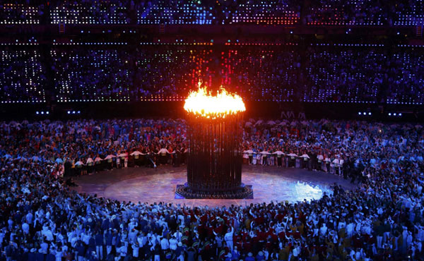 Seven teenagers light Olympic cauldron