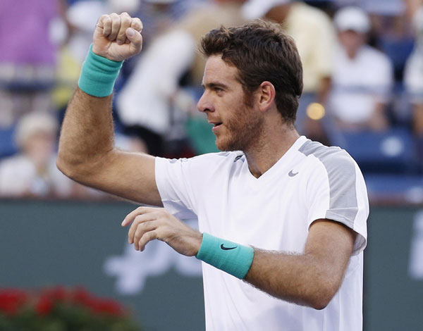 Murray ousted by Del Potro, Djokovic cruises