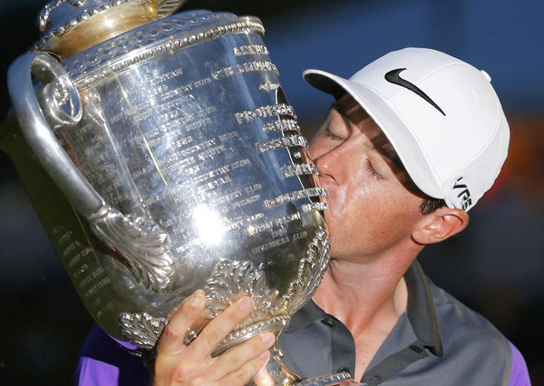 McIlroy wins PGA in thrilling show on soggy turf