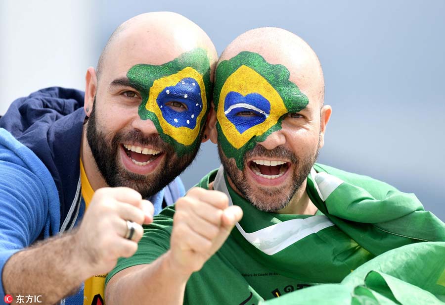 Fans with face paint celebrate Olympics