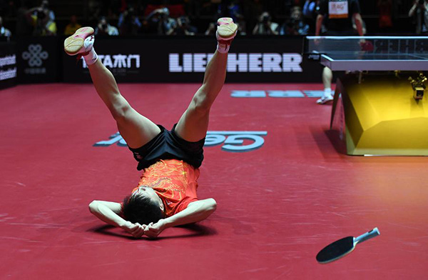 Ma Long retains men's in thrilling final