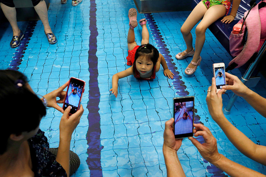 Commuters go for a swim on sports-themed trains in Taipei