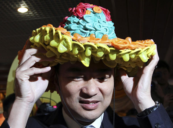 Hat made with condoms falls on PM's head