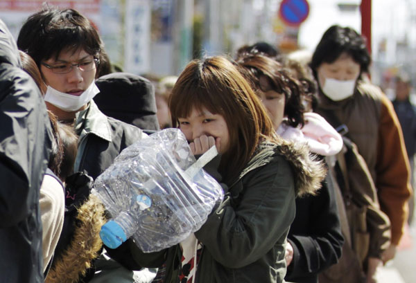 Residents queue for supplies after quake in Japan