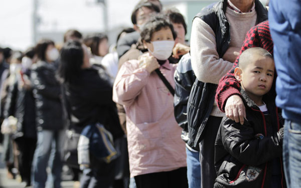 Residents queue for supplies after quake in Japan