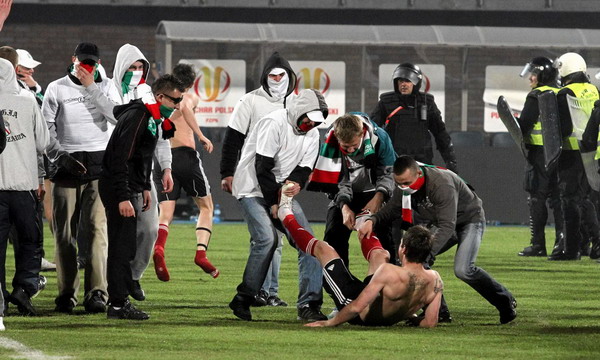 Polish hooligans undress player after match