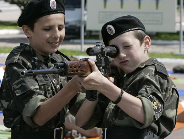 Ukrainian teenagers armed at military base