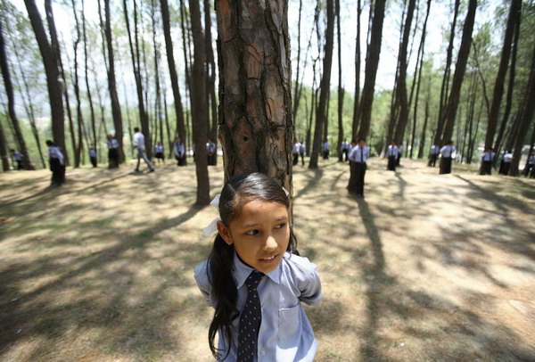 Nepalis hold trees to claim Guinness