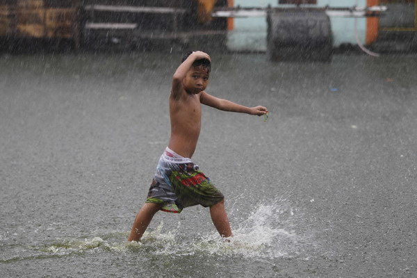 24 dead, 9 missing in slow-moving Philippine storm