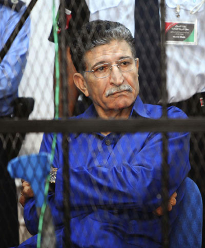 Gadhafi's spy chief put on trial in Libya