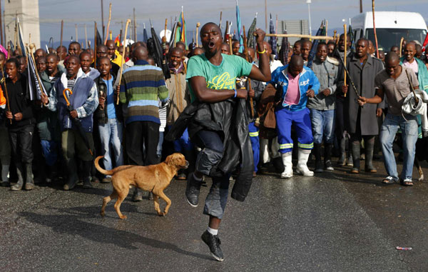 S. African miners march outside Marikana mine